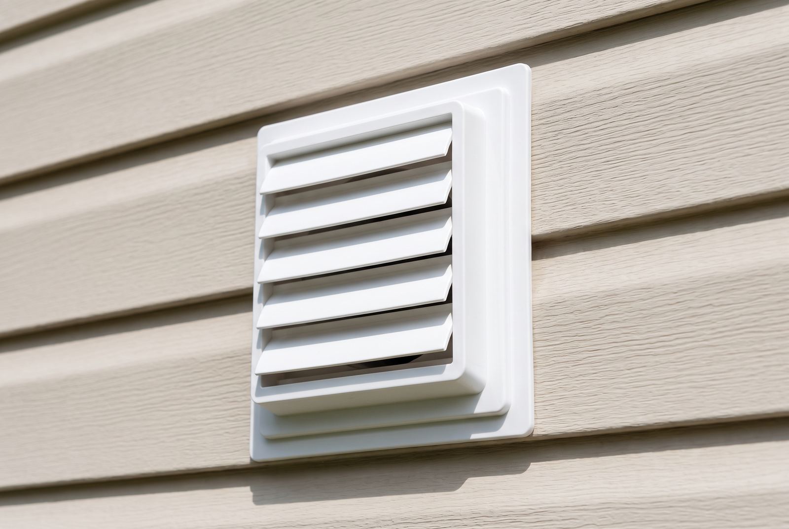 Clean exterior dryer vent cap on a Cleveland-area home
